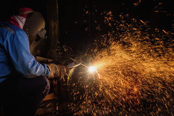 Gouging welding steel structure and bright sparks in steel construction industry.