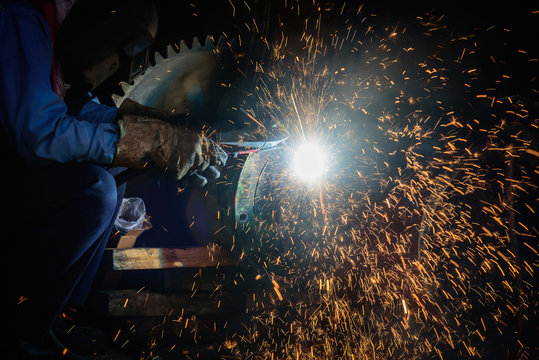 Gouging welding steel structure and bright sparks in steel construction industry.