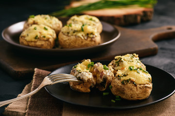Baked mushroom caps stuffed with creams cheese, garlic and herbs.