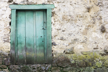 A green door in a village in cantabria