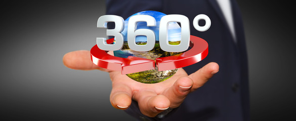 Man holding 360 degree 3D render icon in his han