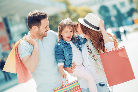 Young family enjoying shopping