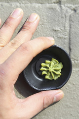 wasabi in a cup, the cup handle wasabi, wasabi paste cup down on the ground, the idea of living art.