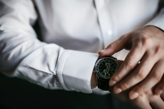 Businessman Looking At His Watch On His Hand, Watching The Time