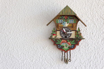 A cuckoo clock hanging on the wall