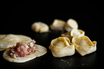 traditional raw manti with meat inside