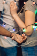 Marriage proposal, unrecognizable man with ring. Happy couple in love bound together. Surprise, happiness, tenderness and romantic feeling at holiday concept.