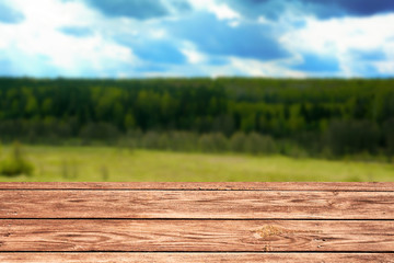 blurred nature background with wooden table