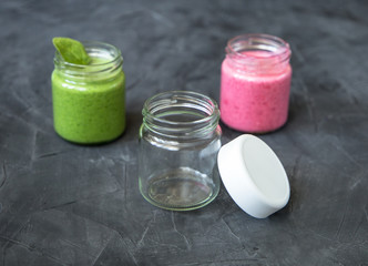 fresh smoothie variations in jars ans an empty jar