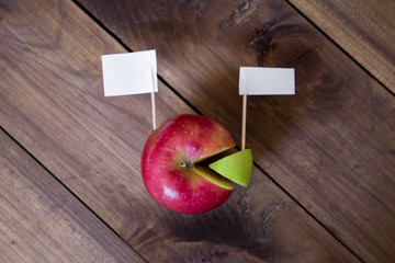 white flags thumbtack on chart made from apple