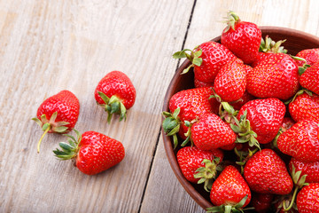 strawberry in a clay plate