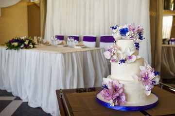 Wedding classic three tiered cake in banquet hall