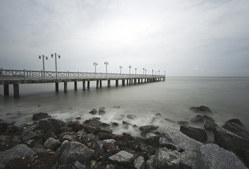 A jetty leading out into the sea for fisherman to dock their boats.