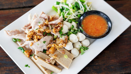 Boiled pork dip with hot and sour sauce (Thai food).
