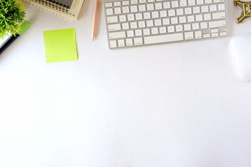 Workspace and office stuff on white desk table with copy space. for text ,product or graphic montage.