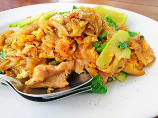 Close up Stir fried flat noodle and pork (Thai Food)