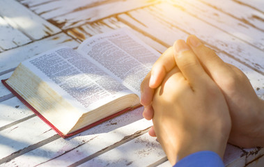 Naklejka premium Man reading from the holy bible, close up