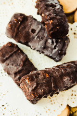 Homemade raw chocolate candy snickers bars. Vegan dessert.