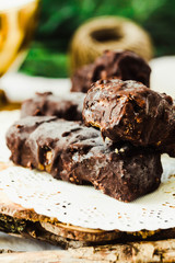 Homemade raw chocolate candy snickers bars. Vegan dessert.