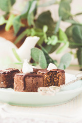 Raw chocolate candy with nuts and coconut, healthy vegan dessert