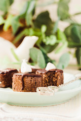 Raw chocolate candy with nuts and coconut, healthy vegan dessert