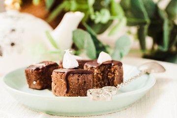 Raw chocolate candy with nuts and coconut, healthy vegan dessert
