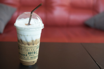 iced mocha with straw in plastic cup