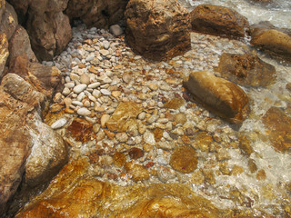 The rocks beside the beach.