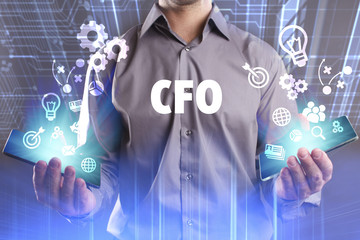 Business, Technology, Internet and network concept. Young businessman working on a virtual screen of the future and sees the inscription: CFO