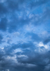 Beautiful clouds at sunset after rain as background .