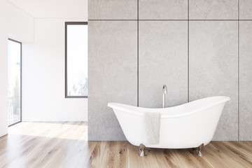 Obraz na płótnie Canvas Concrete bathroom, white tub