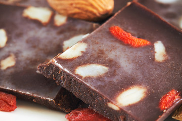 Homemade vegan chocolate with almonds and goji berries