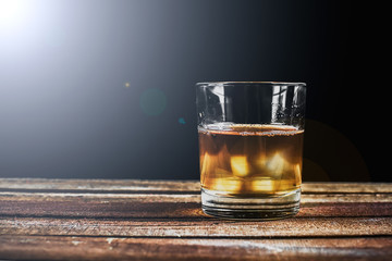 Whiskey on wooden surface