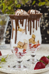 Chia seed pudding with strawberry and biscuits in a glass