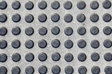 sidewalk, pavement, black slip on the road.