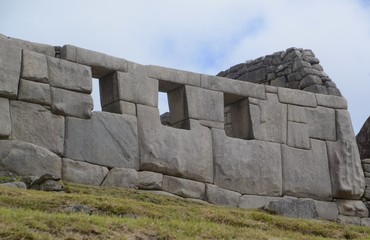 The incredible stone work of the Temple of three windows at the Machu Picchu site in Peru.  © mat_millard