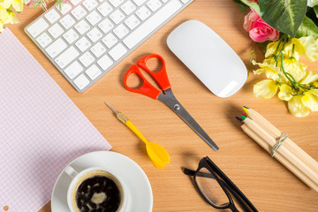 working place at wooden desktop with coffee