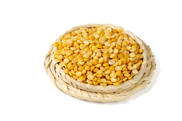 Dry yellow split peas isolated on white.