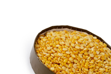 Dry yellow split peas isolated on white.