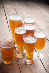 glass beer on wood background