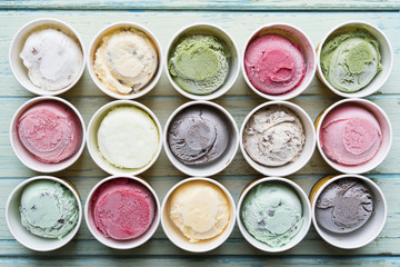 Top view Ice cream flavors in cup on background