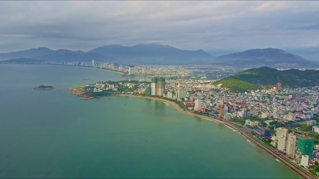 Drone Flies over Azure Sea Coast with Modern Resort City
