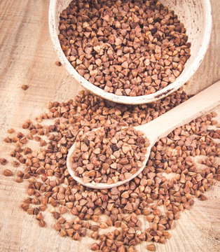 Dry buckwheat groats. Healthy food and diet concept.