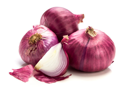 The Fresh red onion sliced bulb and onion peel isolated on white background