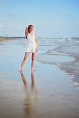 Young woman enjoying her vacation by sea