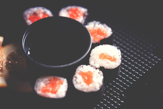 Sushi rolls with salmon and soy sauce 