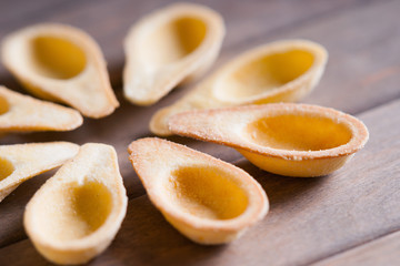 Photography of a empty tartlets on a wooden background 