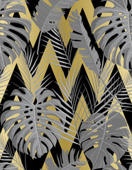 Tropical seamless pattern with exotic palm leaves.