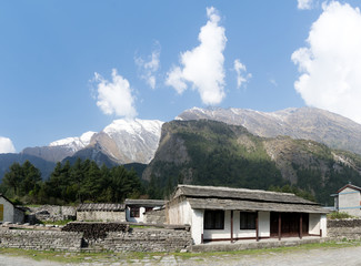 House under the Shadow of the Mountains