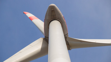 Close up of  wind turbine propeller blades in the blue sky 